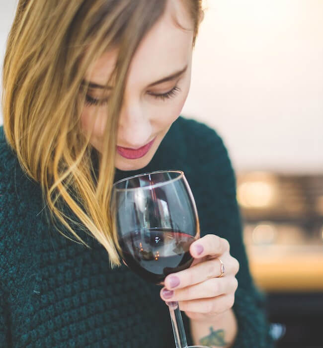 woman tasting wine